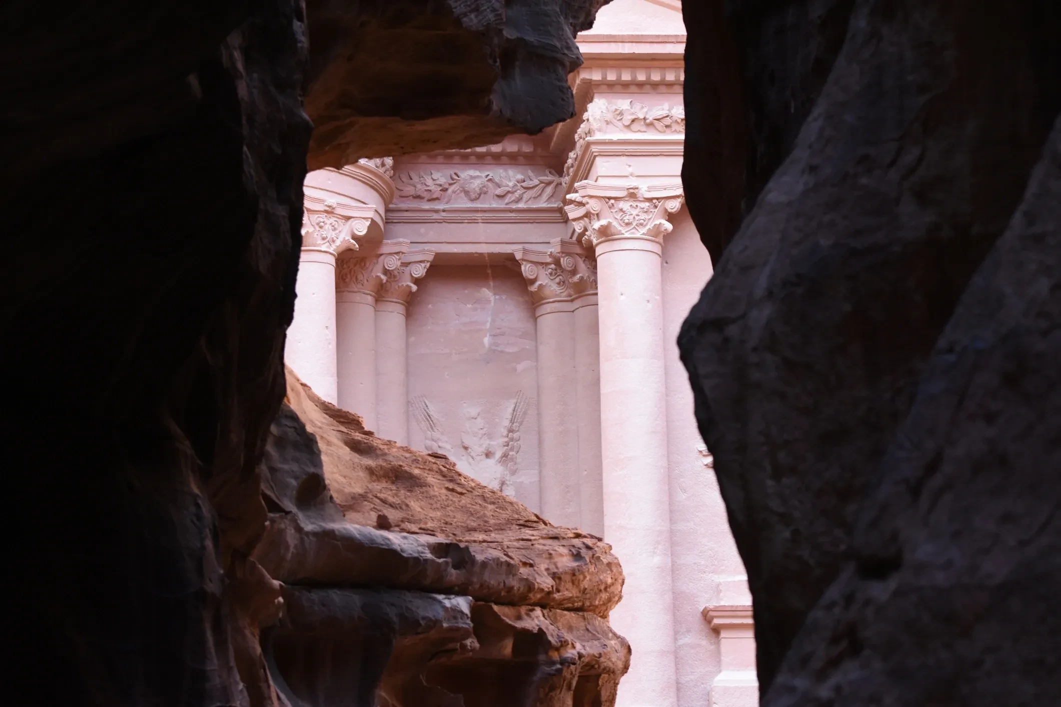 The Petra Treasury viewed through a rock opening