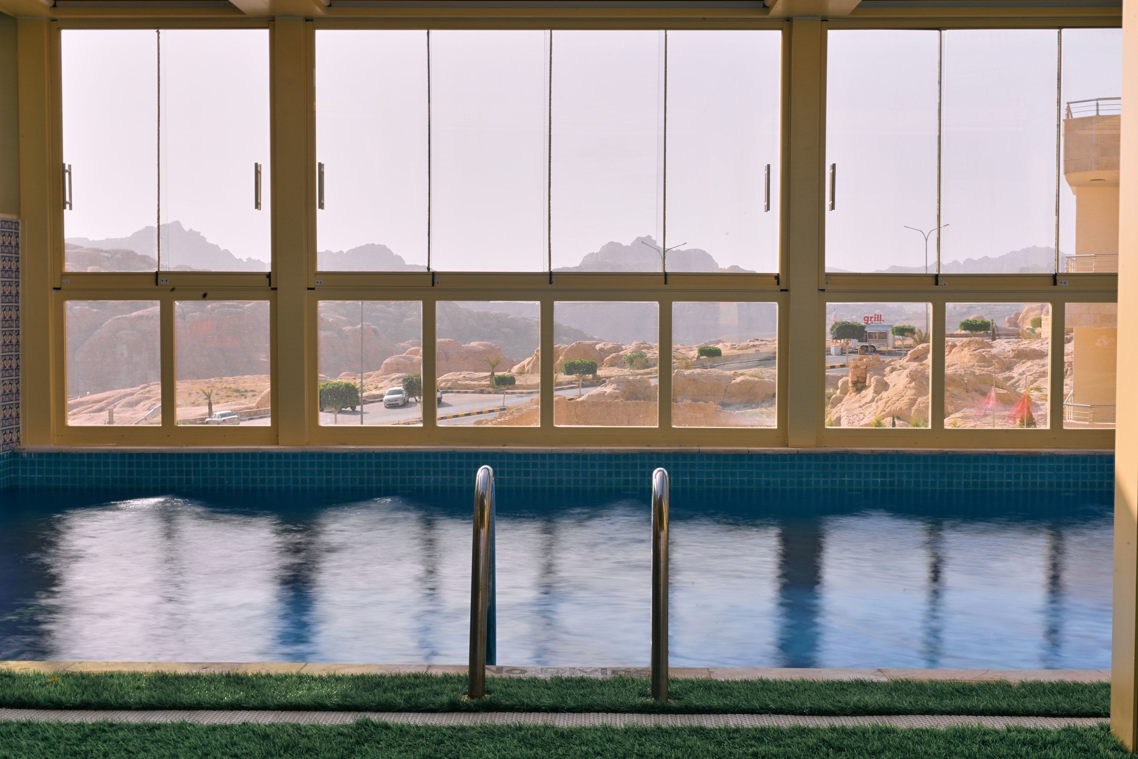 Indoor pool with panoramic views of Petra's mountains
