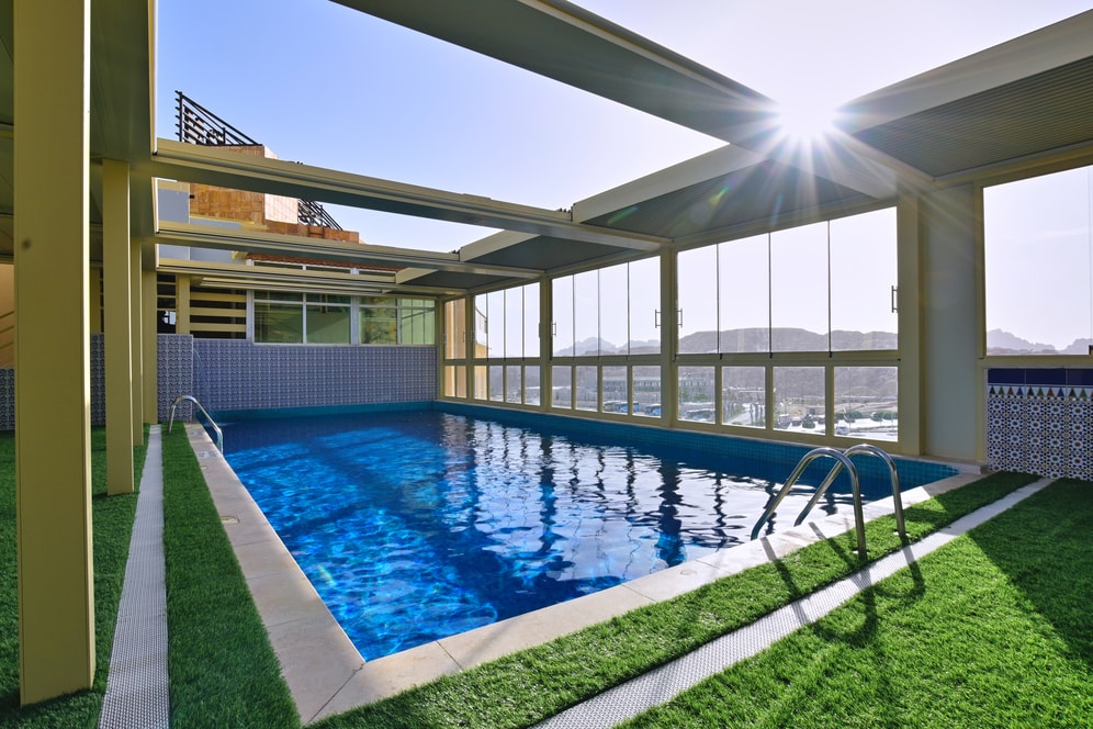 Sunlit Petra Breeze Pool with mountain views