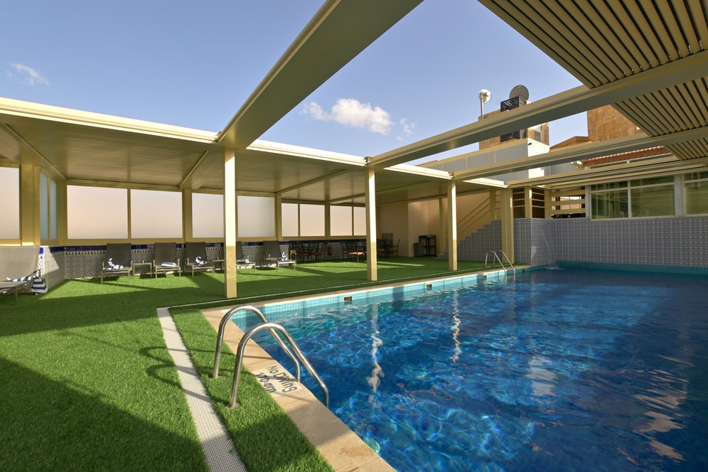Petra Breeze Pool terrace and shaded loungers