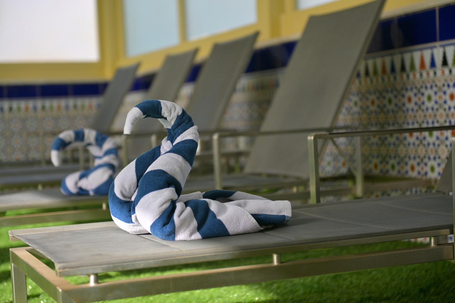Folded pool towel on a Petra Breeze Pool lounger