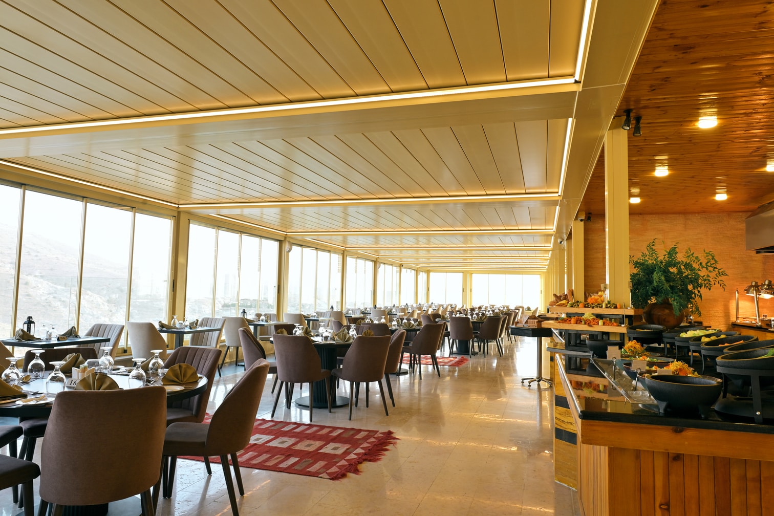 Spacious Petra Breeze Restaurant dining room with buffet station