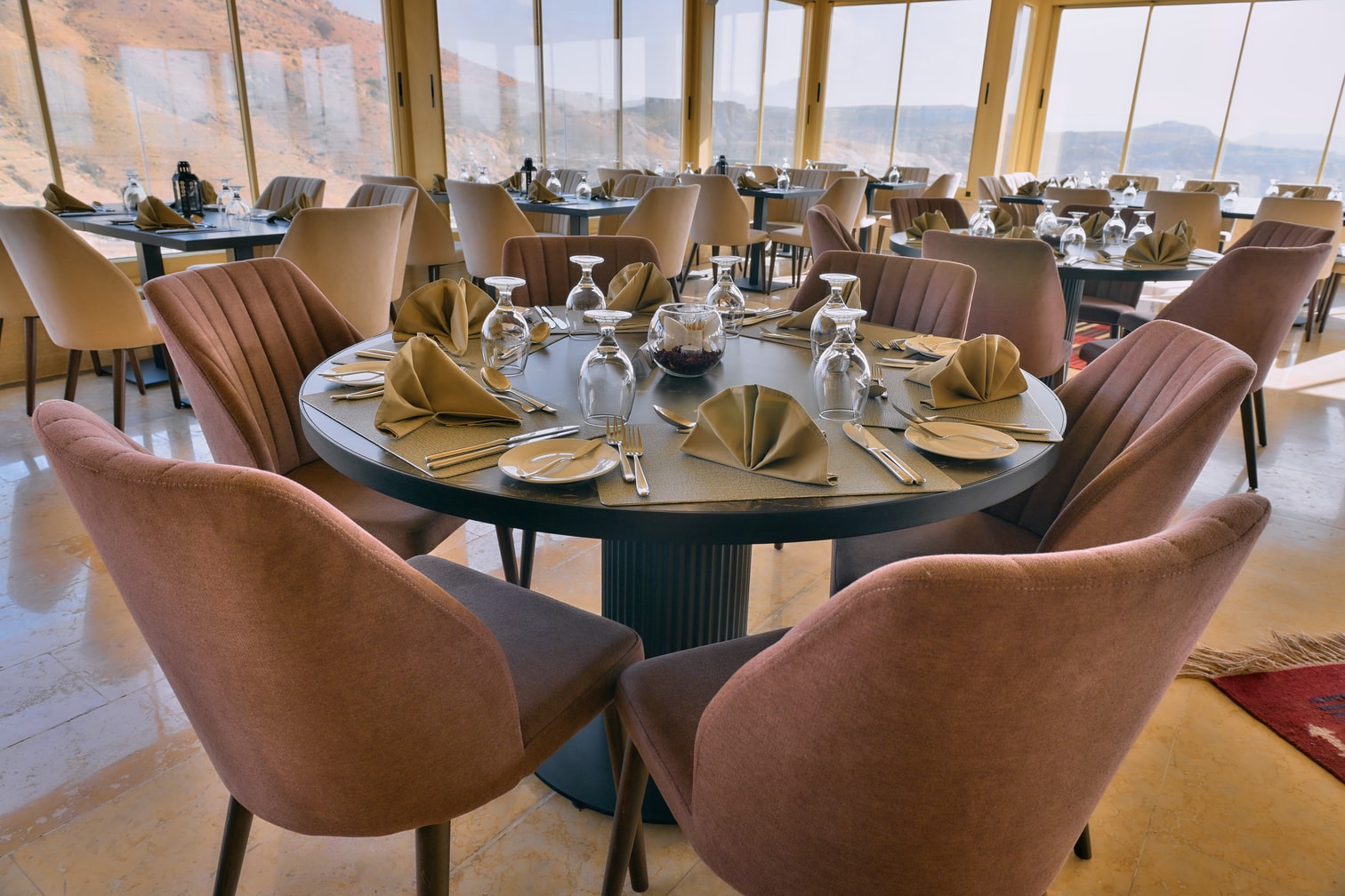 Warmly lit dining room at Petra Breeze Restaurant