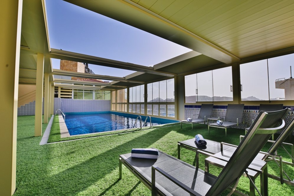 Rooftop pool overlooking Petra's rose-red cliffs
